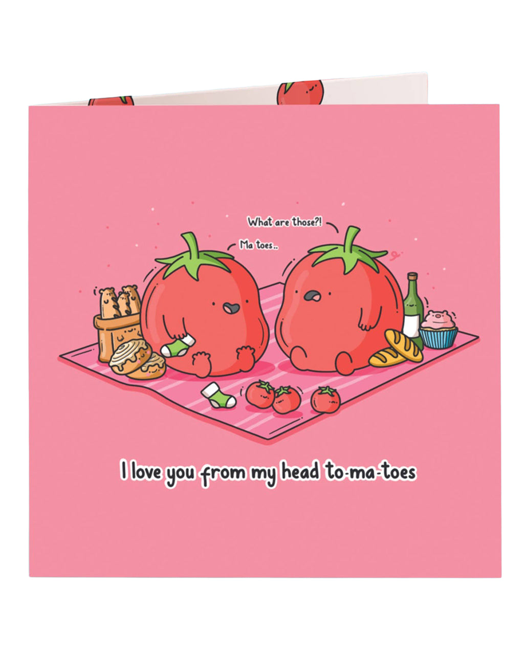 Front of a pink square greeting card featuring two cartoon tomatoes having a picnic. One tomato looks surprised as the other says “Ma toes,” pointing to its feet. Text reads: “I love you from my head to-ma-toes.” A cute and punny love card designed by Toastedink, stocked by Rebel Romance.