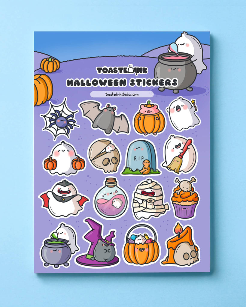Full Halloween sticker sheet from Toastedink on blue background, with kawaii ghost characters dressed as vampires, witches, mummies, plus potion bottles, pumpkins and spooky treats – perfect for Halloween journaling.