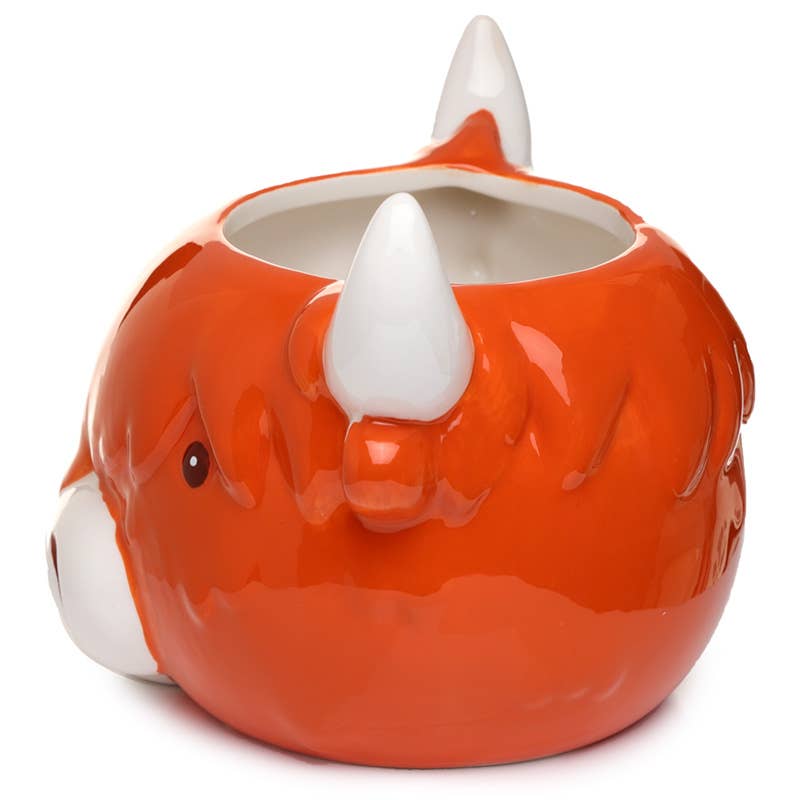 Angled rear view of the Rebel Romance Highland Coo Mug, showing the cow’s ear and chunky white horns. The mug's sculpted shape gives it a fun and cheeky character.