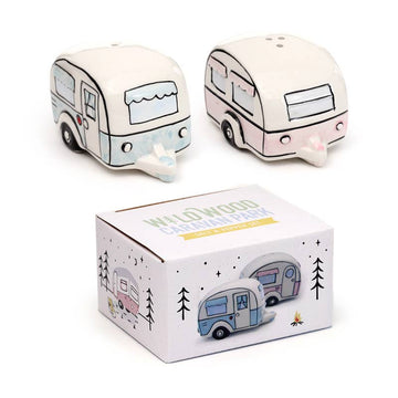 Complete set of ceramic caravan salt and pepper shakers shown with their illustrated gift box. Designed by Rebel Romance, these pastel pink and blue caravans add nostalgic charm to any home or camper kitchen.