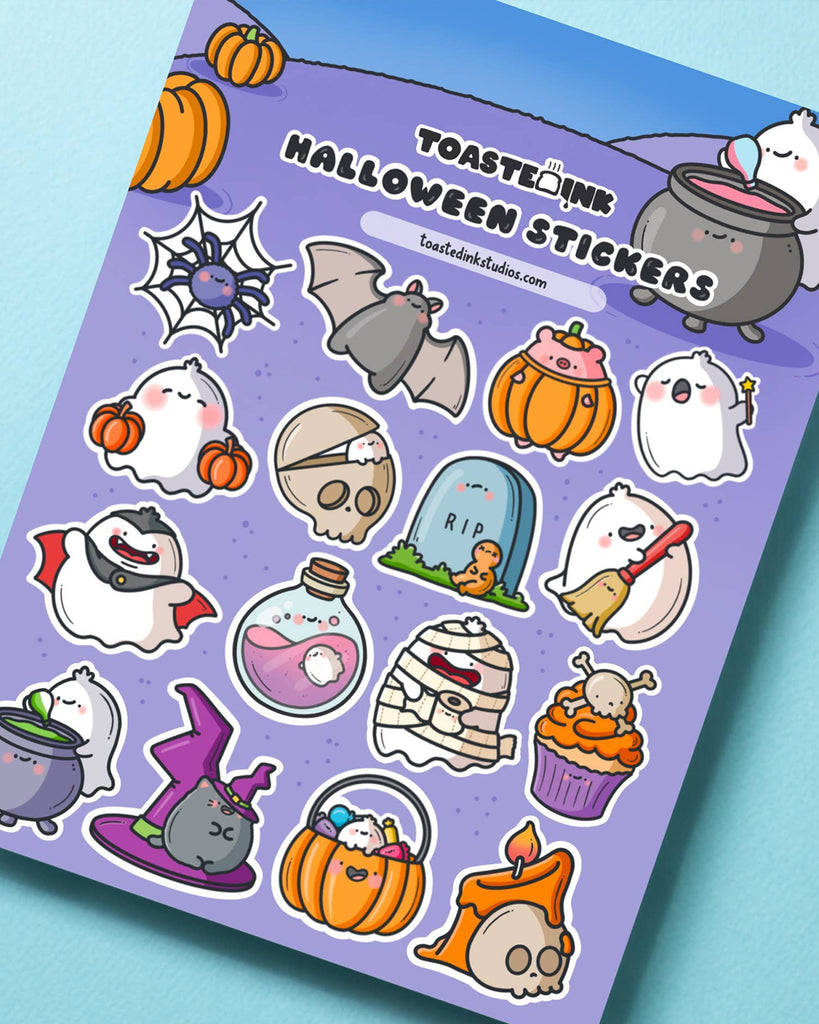 Halloween sticker sheet by Toastedink featuring cute ghost, pumpkin, bat, spider, vampire, potion, mummy, cupcake, and black cat illustrations on a purple background, perfect for spooky journaling and planner decoration.