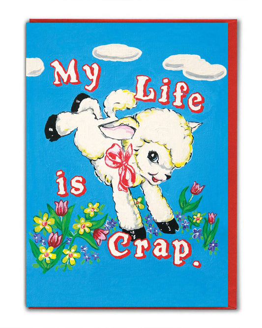 Quirky greeting card by Rebel Romance featuring Magda Archer’s kitsch artwork. A retro-style illustration of a fluffy lamb with a pink bow, jumping among colourful flowers and clouds, with the cheeky slogan “My Life is Crap.” Perfect alternative card for millennials who love bold, funny, and unique designs. Printed in the UK on FSC accredited card with a bright envelope.