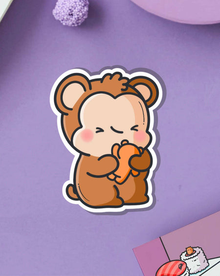 Adorable monkey and teddy bear vinyl sticker by Toastedink, shown on a lilac purple backdrop with decorative props. Available from Rebel Romance, a UK-based small biz for alternative fashion and retro-inspired accessories.
