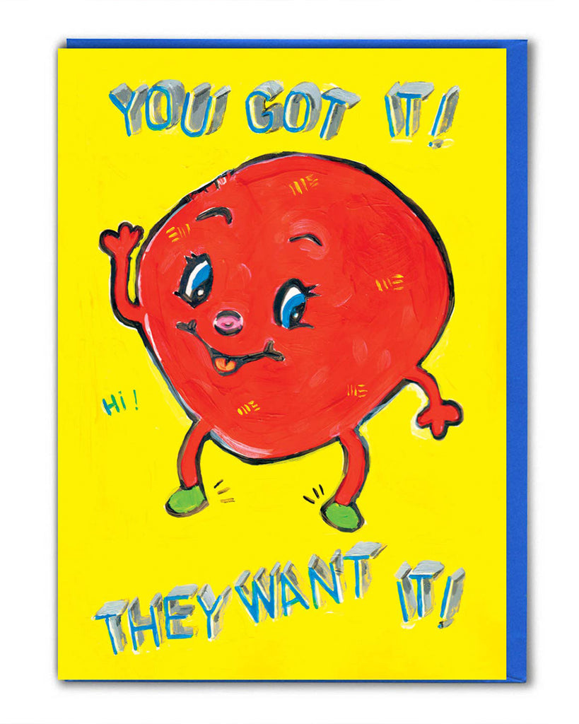 Rebel Romance greeting card illustrated by Magda Archer. The design features a kitschy red cartoon character with a cheeky face and waving hand on a bright yellow background. The bold text reads “YOU GOT IT! THEY WANT IT!” in playful blue 3D lettering. A quirky, retro-style card perfect for birthdays or celebrations. Printed sustainably in the UK, it comes with a bright blue envelope.