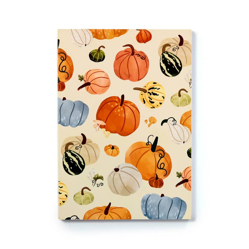 Front cover of the Autumn Harvest Notepad by Rebel Romance featuring a vibrant illustrated pattern of multicoloured pumpkins. This playful and autumnal design adds a retro-inspired touch to your stationery collection.