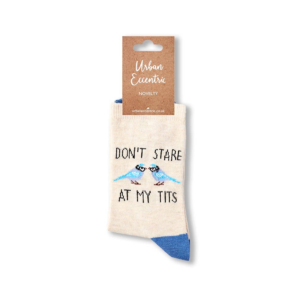 Urban Eccentric novelty socks with beige base, blue accents, and “Don’t Stare at My Tits” slogan with blue tit birds. Packaged with branded label. Available at Rebel Romance.