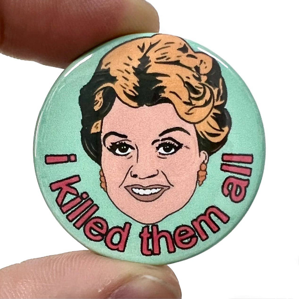 Rebel Romance I Killed Them All Murder She Wrote Button Pin Badge designed by Bite Your Granny. A 38mm round glossy badge featuring a retro cartoon-style illustration of Jessica Fletcher with the quote "I killed them all" in bold pink letters. A quirky, campy gift made in Brighton by a UK indie brand that celebrates alternative style and millennial nostalgia.