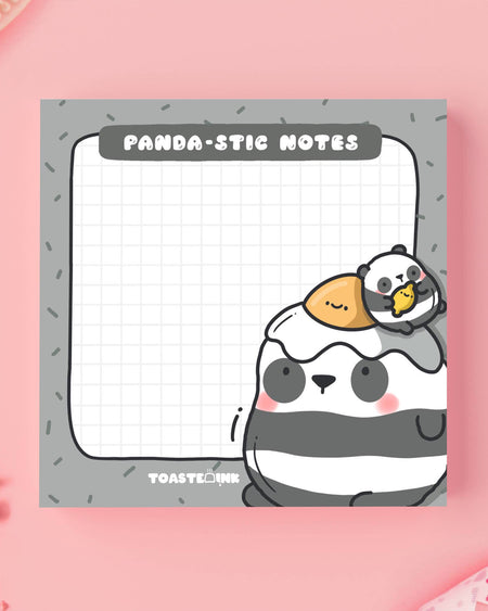 Close-up of the Panda-stic Notes by Toastedink, featuring a chunky grey-and-white panda with a fried egg hat and chick friend. Fun sticky notes stocked by Rebel Romance, perfect for planning and doodling with cuteness.