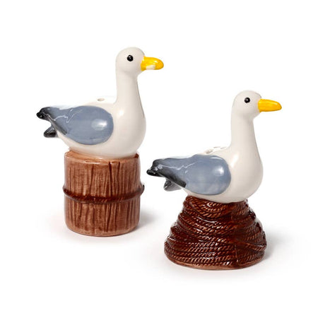 The full Seagull Buoy Salt & Pepper Set by Rebel Romance, including two ceramic shakers. One seagull sits on a rope coil, the other on a wooden post. A fun nautical gift for ocean lovers, retro collectors, and quirky home décor fans.