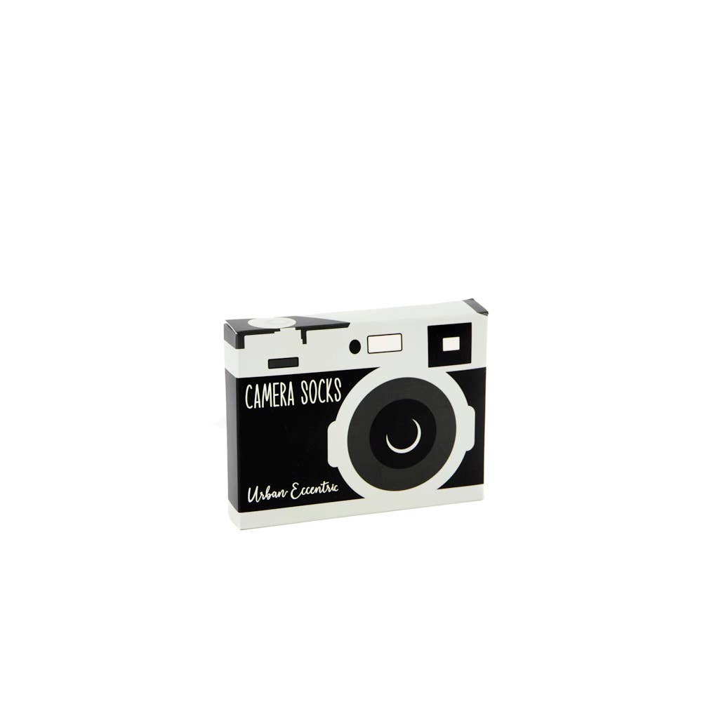 Urban Eccentric camera socks packaging styled like a retro camera, in black and grey. A unique novelty gift, available at Rebel Romance.