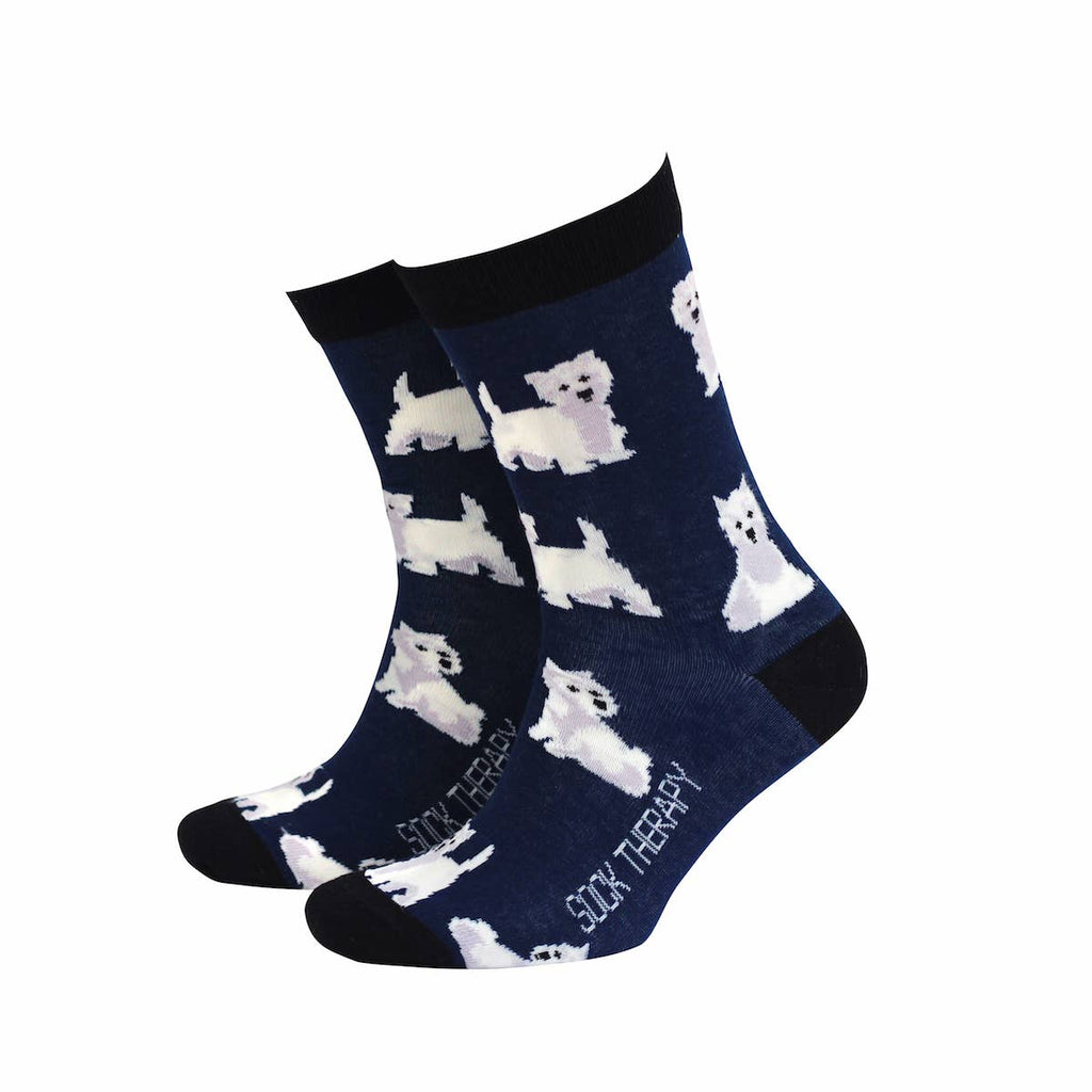 Smiling Faces eco-friendly bamboo socks in navy blue featuring a repeat pattern of white West Highland Terriers with black trim. Fun novelty socks sold at Rebel Romance.