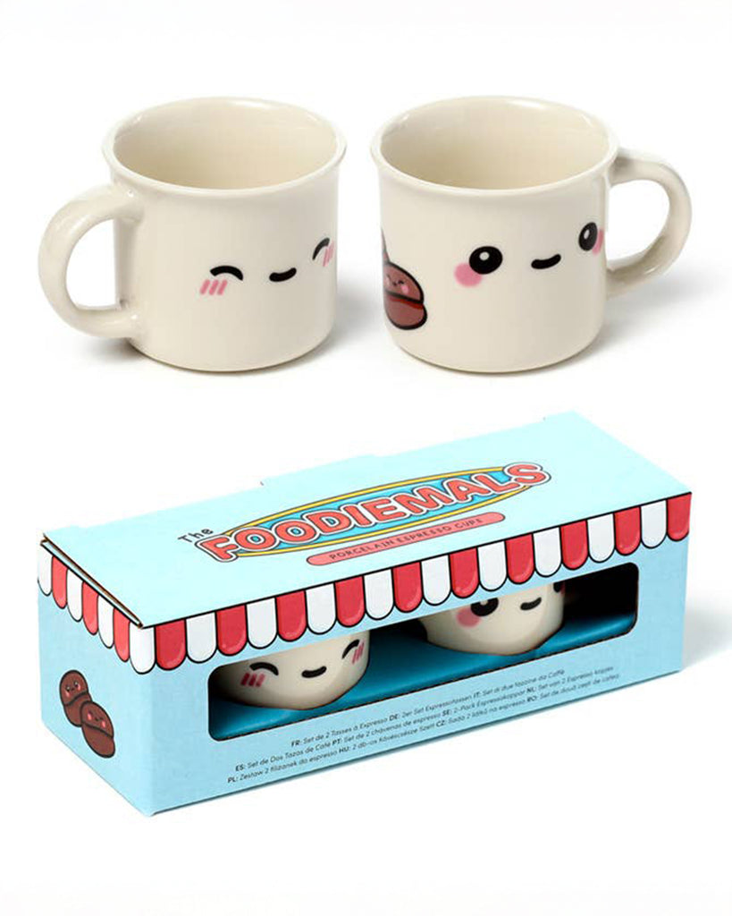 Porcelain espresso cup with an adorable Foodiemals face featuring round black eyes, pink cheeks, and a tiny smile. Designed by Rebel Romance, a UK indie brand known for its quirky, retro-inspired gifts and homeware.