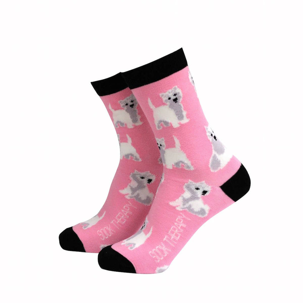 Pink eco-friendly bamboo socks by Smiling Faces, decorated with playful Westie dog pattern and black heel, toe, and cuff. Fun dog lover socks sold by Rebel Romance.