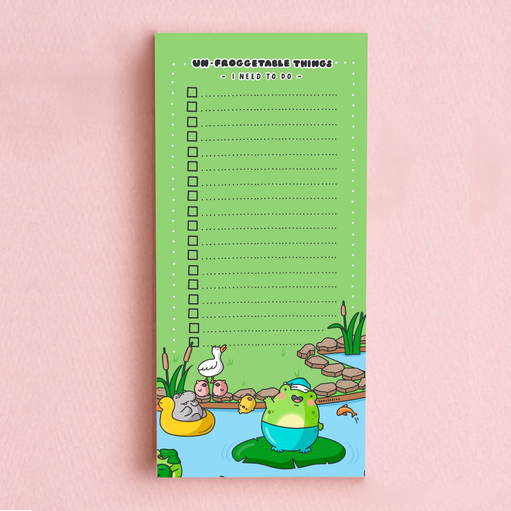 A green DL-sized to-do list pad titled “Un-froggetable things I need to do” with a checklist of dotted lines and tick boxes. The bottom features a cute cartoon frog in a blue floatie, sitting on a lily pad, surrounded by pond animals and plants. Perfect for fun and functional daily planning.