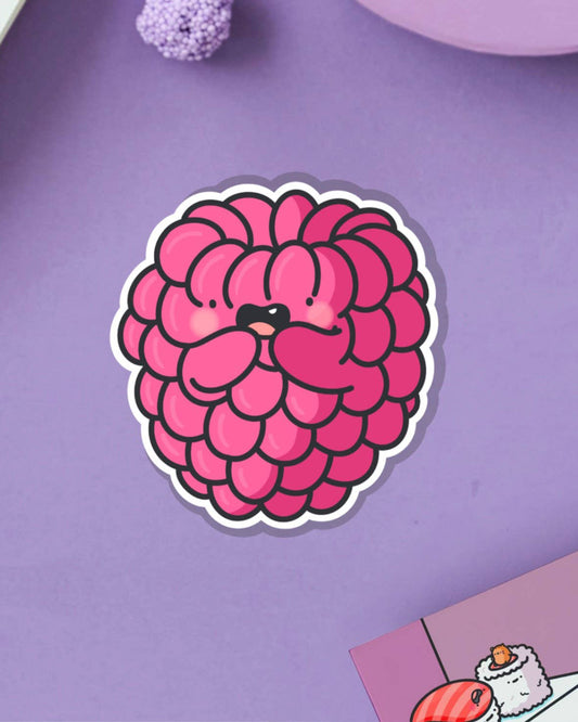 Glossy raspberry character vinyl sticker designed by Toastedink, styled on a lilac background with playful textures. Available from Rebel Romance, a small UK business that embraces quirky, nostalgic, and alternative vibes.