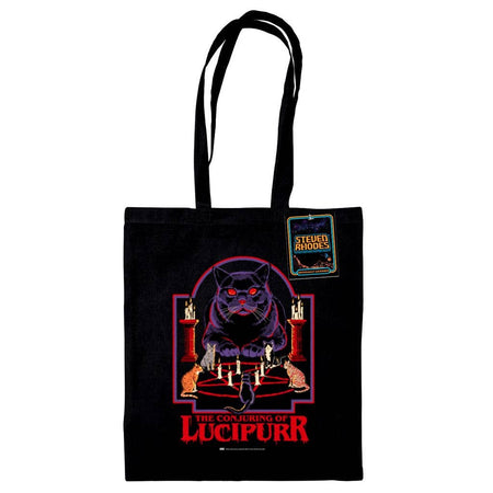 A black tote bag featuring Steven Rhodes’ “The Conjuring of Lucipurr” design. The artwork shows a black cat with glowing red eyes sitting amidst candles and a pentagram, exuding gothic and occult vibes. The text “The Conjuring of Lucipurr” appears in bold red, dripping letters. A perfect blend of spooky and quirky style.