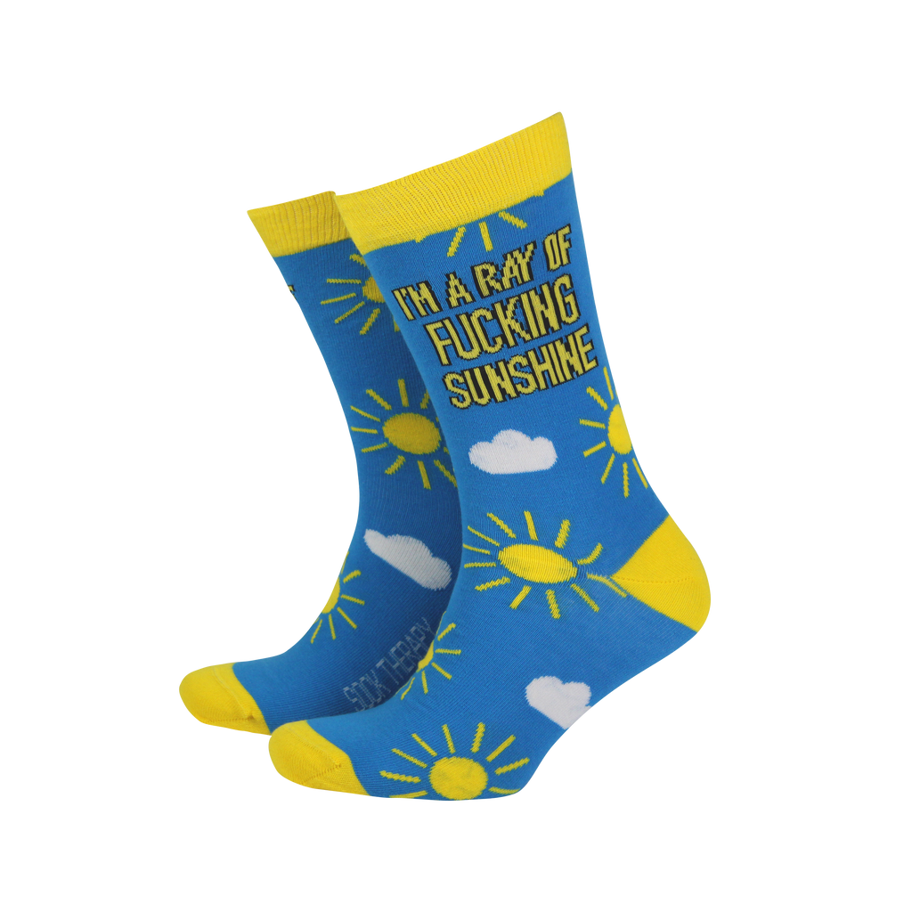 Ray of Sunshine Bamboo Socks in UK size 8–11, featuring a bold design with yellow suns, white clouds, and the cheeky slogan "I'm a ray of f*cking sunshine" on bright blue fabric. Ethically made and eco-friendly, available from Rebel Romance – a UK small business selling alternative fashion and fun statement gifts for millennials.