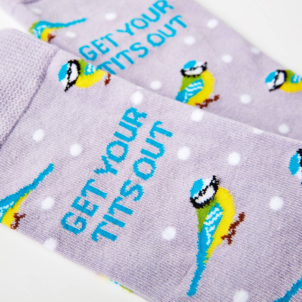 Detailed close-up of Urban Eccentric socks featuring bold “Get Your Tits Out” text with blue tit illustrations and polka dot pattern. Stocked by Rebel Romance.