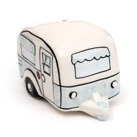A ceramic salt or pepper shaker styled like a retro caravan in cream and pastel blue, complete with hand-drawn windows and tiny wheels. A charming, quirky gift from Rebel Romance, ideal for millennial campers and collectors.