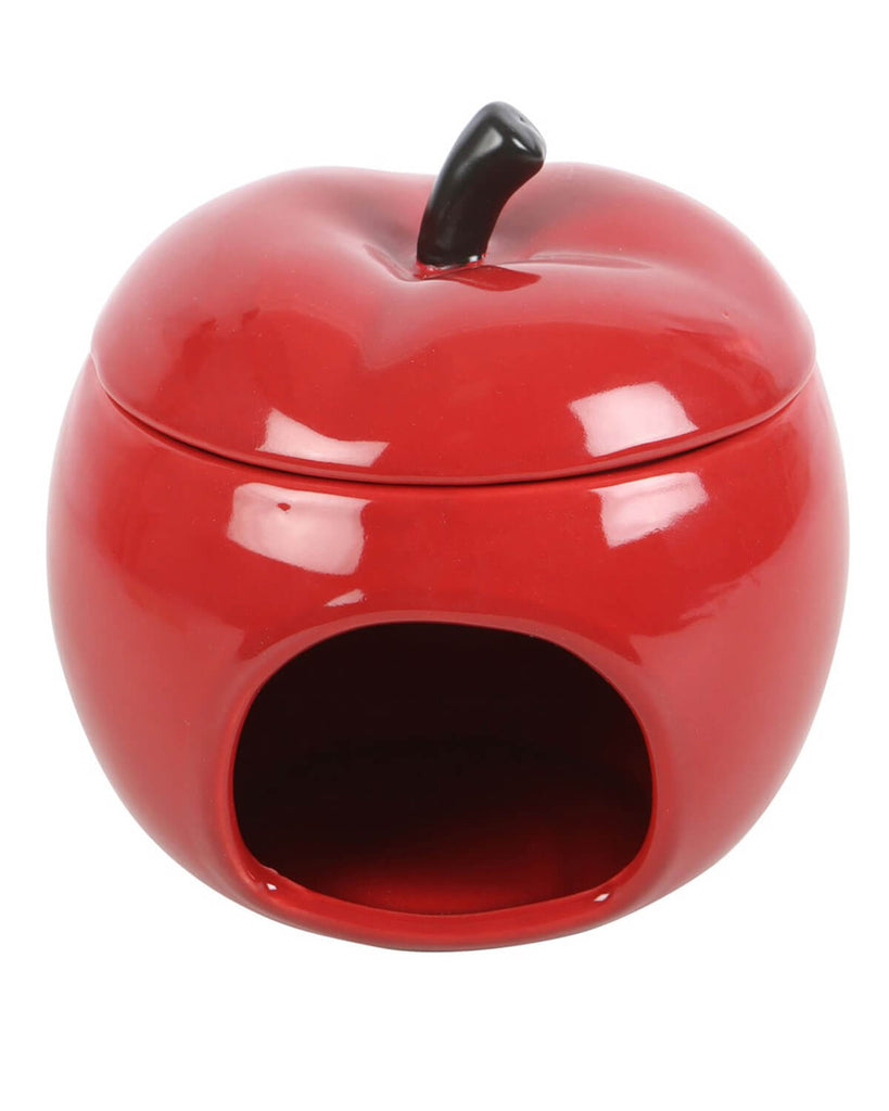 Front view of the apple oil burner with the tealight opening visible.