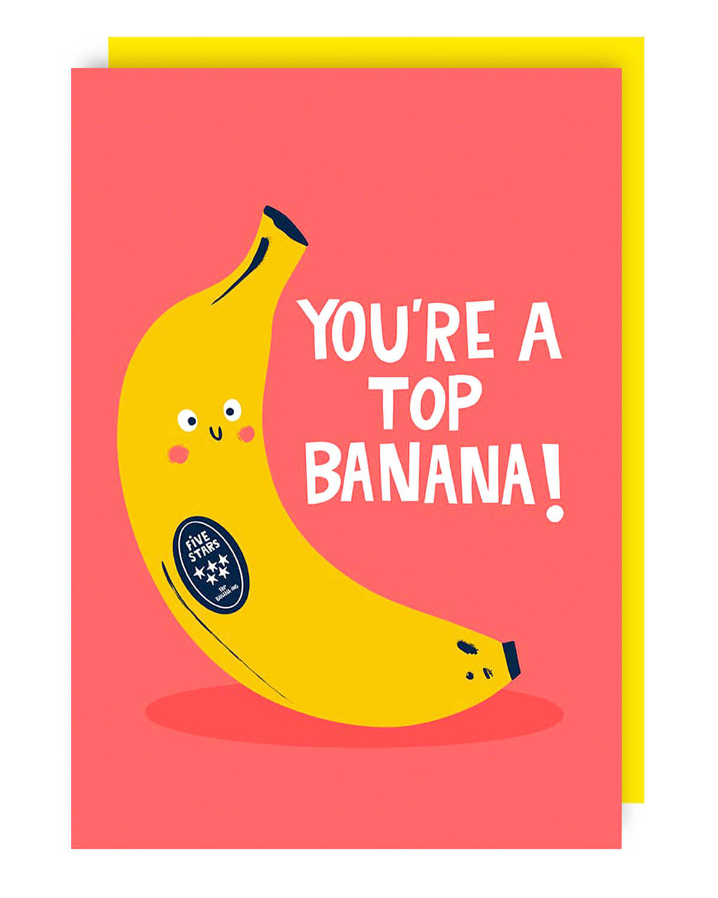 A bright pink greeting card with a happy yellow banana illustration, featuring a five-star sticker and the text “YOU’RE A TOP BANANA!” in bold white letters. A yellow envelope is tucked behind the card.