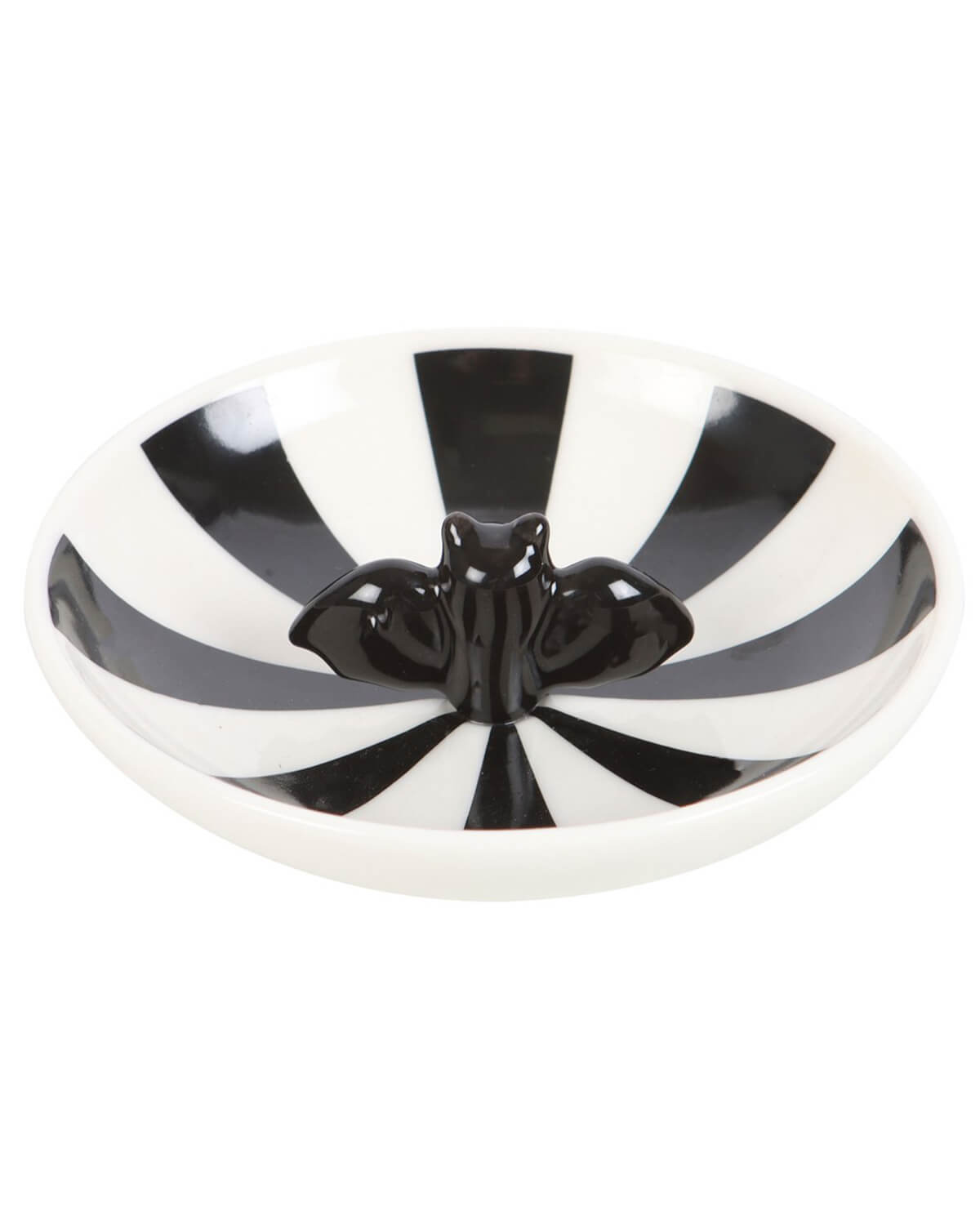 Close-up of a round ceramic trinket dish with black and white striped design and a glossy black bat figure in the centre.