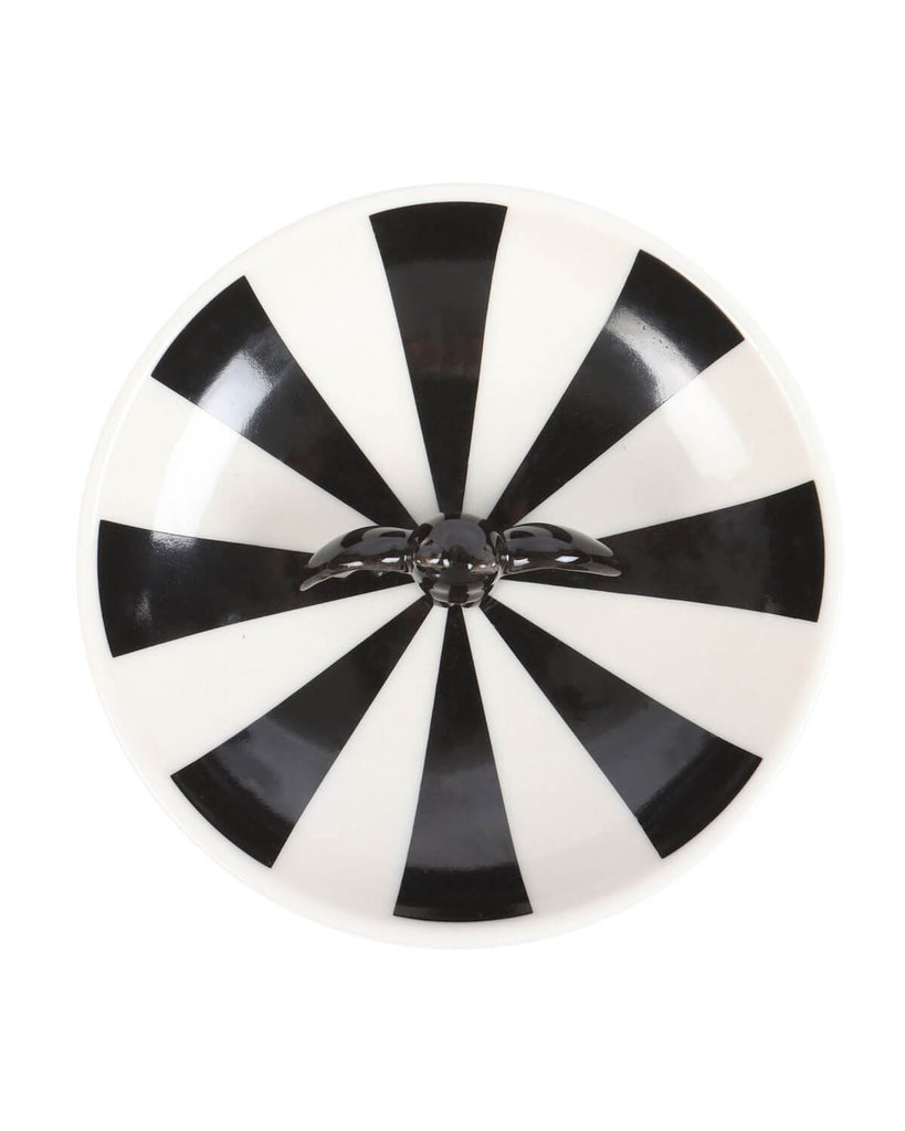 Overhead view of the striped bat trinket dish, showing the bold geometric pattern and glossy black bat detail.