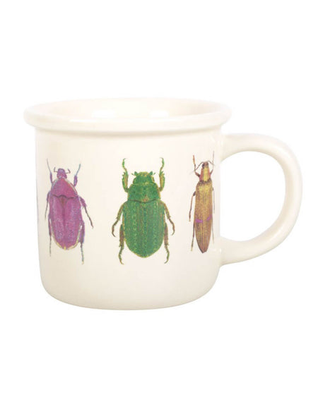 MUG WITH BEETLE PRINT. there are three different beetles drawn on the mug