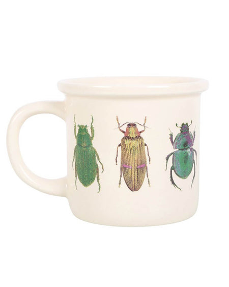 MUG WITH BEETLE PRINT. there are three different beetles drawn on the mug