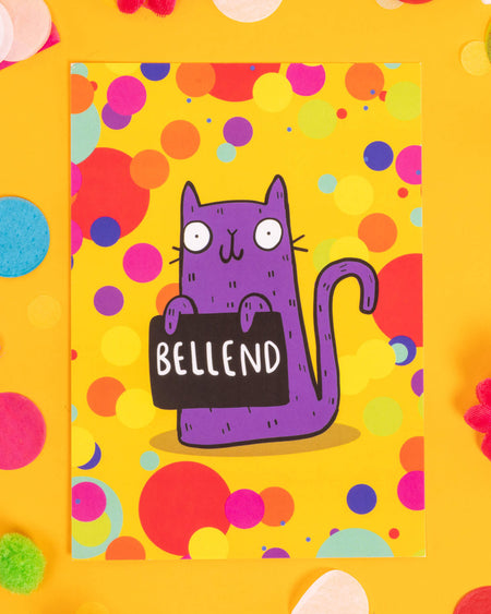 A colourful A6 postcard featuring a cartoon purple cat holding a sign that says “Bellend” against a yellow background filled with multicoloured dots. Designed by Katie Abey, this cheeky sweary card is perfect for alternative millennials who love quirky humour, bold stationery, and giving hilariously rude gifts.