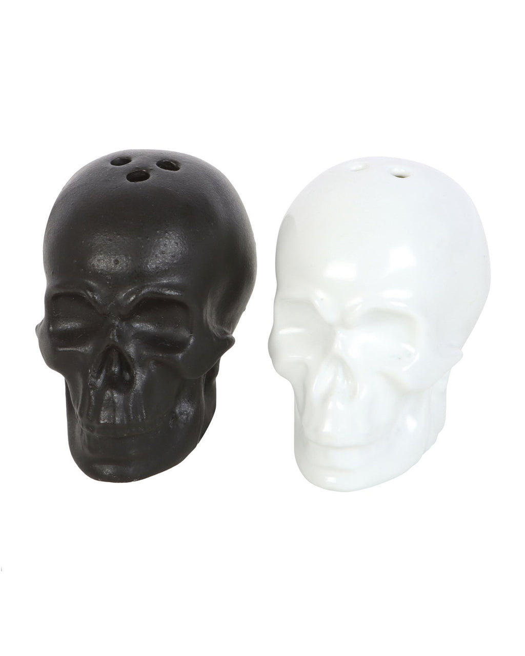 Black and white ceramic skull salt and pepper shakers placed side by side.