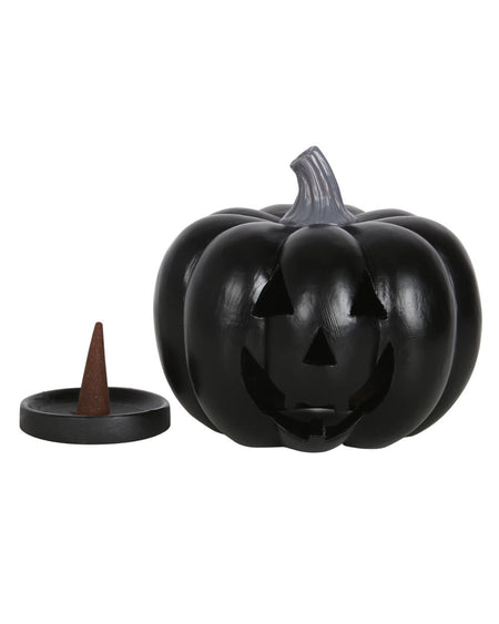 Black pumpkin incense cone holder with a removable lid, showing the interior and a separate black tray with an incense cone ready for use.