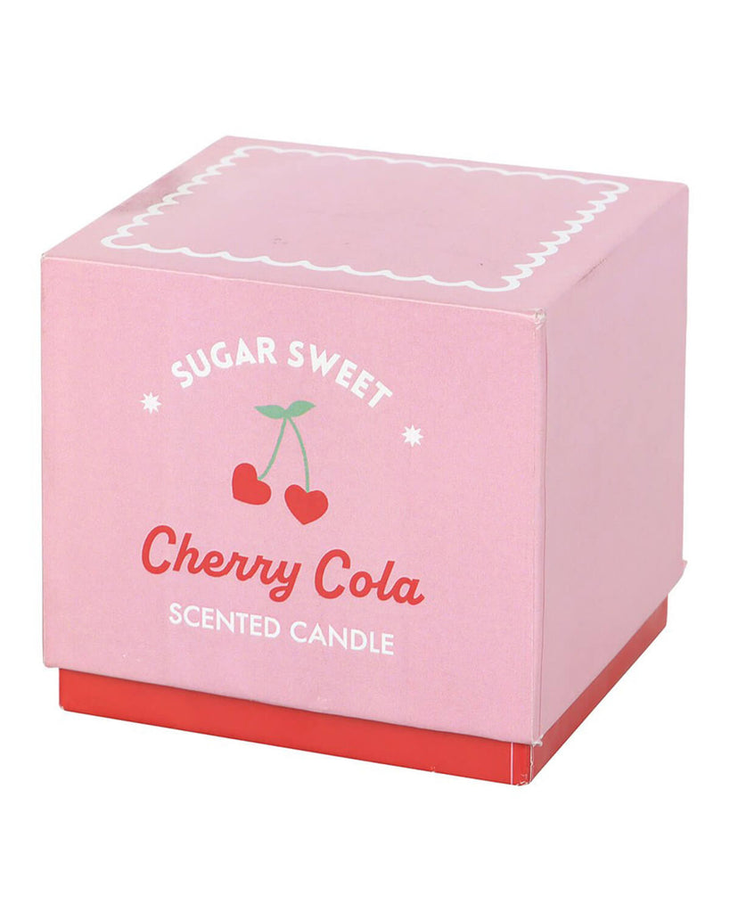 Close-up of the Sugar Sweet Cherry Cola Candle in its pink box, featuring retro-style cherries and scalloped detailing.