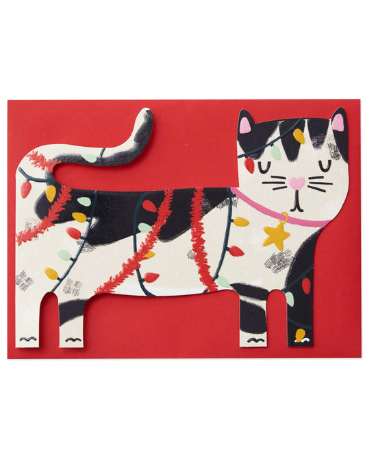 Black and white cat Christmas card featuring a cheeky kitty tangled in red tinsel and multicoloured fairy lights. The die-cut design is finished with embossing and spot UV gloss for a tactile effect, perfect for cat lovers this festive season.