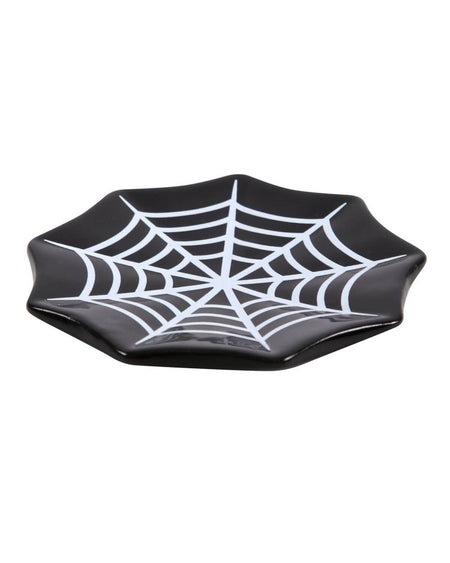 a black and white cobweb trinket dish from a side view