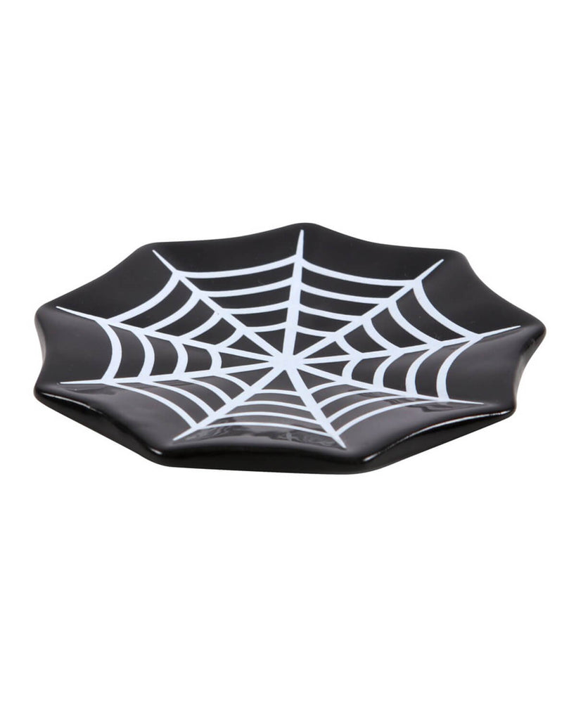 a black and white cobweb trinket dish from a side view