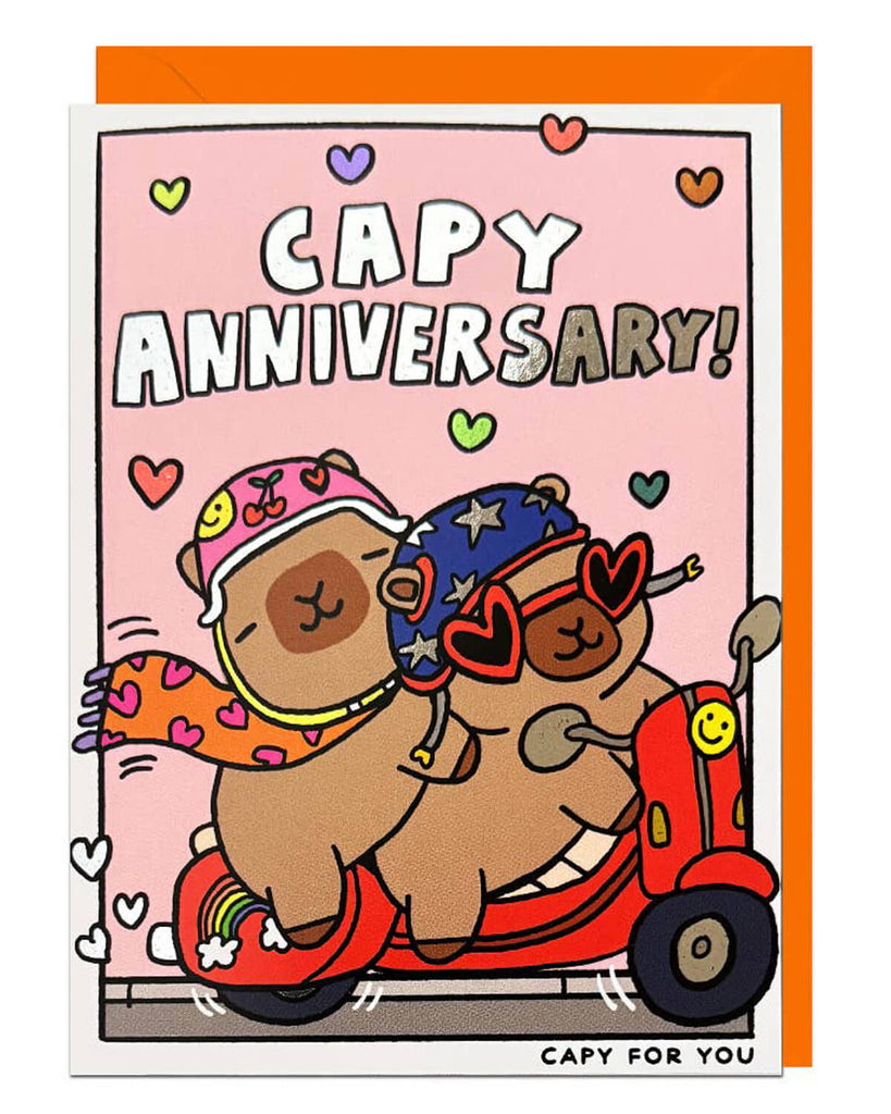 Make anniversaries unforgettable with our Capy Anniversary Foil Card featuring two adorable capybaras on a scooter. Part of the Capy For You range, it’s blank inside for your message and comes with a vibrant orange envelope. Perfect for capybara fans and fun celebrations!
