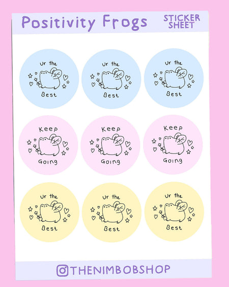 A pastel A5 sticker sheet titled ‘Positivity Frogs Sticker Sheet’ featuring nine circular stickers with hand-drawn fairy frog illustrations by Nimbob. The stickers come in soft pastel shades of blue, pink, and yellow. Each fairy frog is holding a tiny wand, surrounded by sparkles and hearts. The stickers contain uplifting phrases such as ‘Ur the Best’ and ‘Keep Going.’ A whimsical and encouraging sticker set, perfect for planners, notebooks, and adding a little extra positivity to your day!