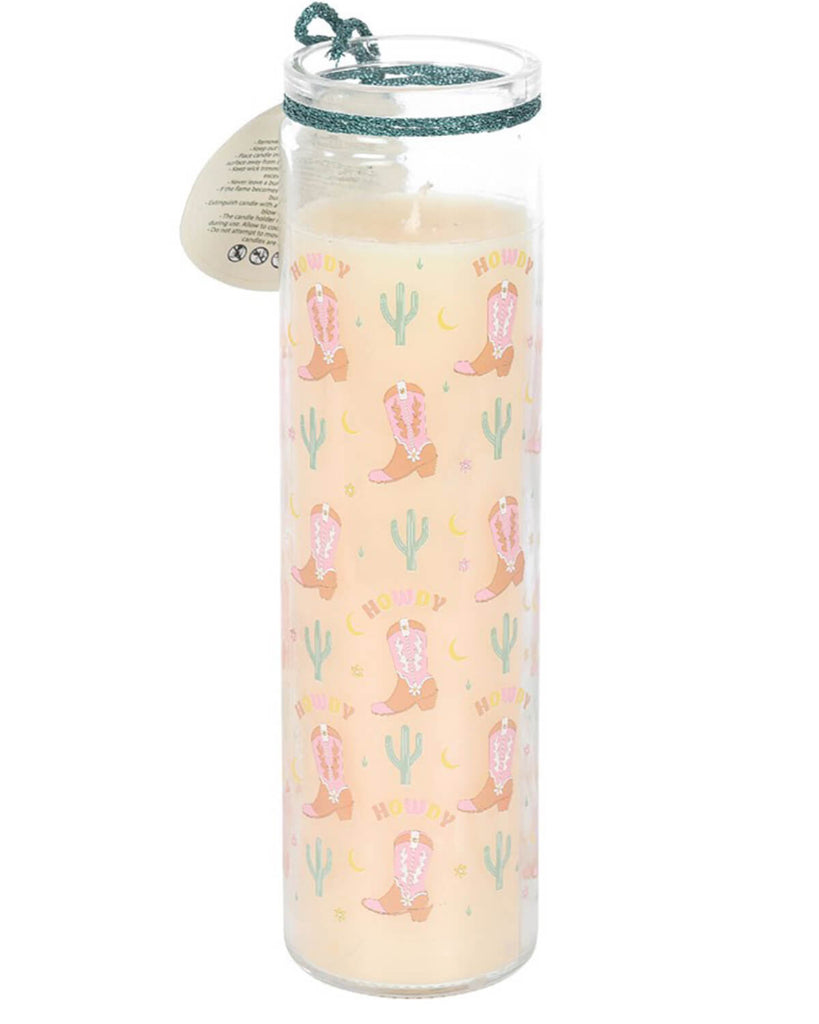 Close-up of the Howdy floral tube candle showing the cowboy boot and cactus pattern with 'Howdy' text on a cream background.