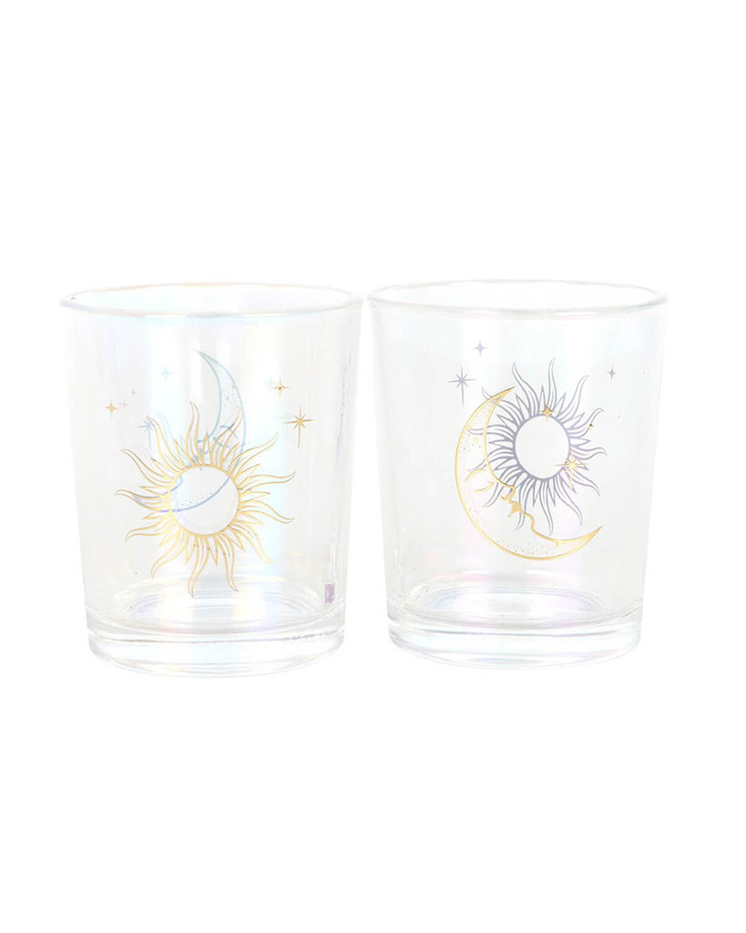 Two glass votive candle holders with iridescent sheen and gold foil designs – one featuring a sun and moon motif, the other with a crescent moon and sunburst.