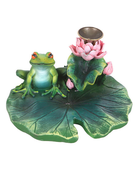Front-facing view of the burner showing the frog, pink flowers, and brass incense holder on the lily pad.