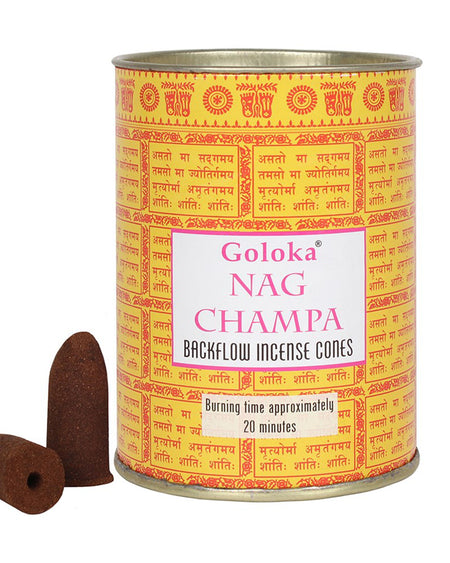 Goloka Nag Champa backflow incense cones in a yellow tin with traditional Indian-style patterns and text label. Two brown incense cones are placed beside the tin.