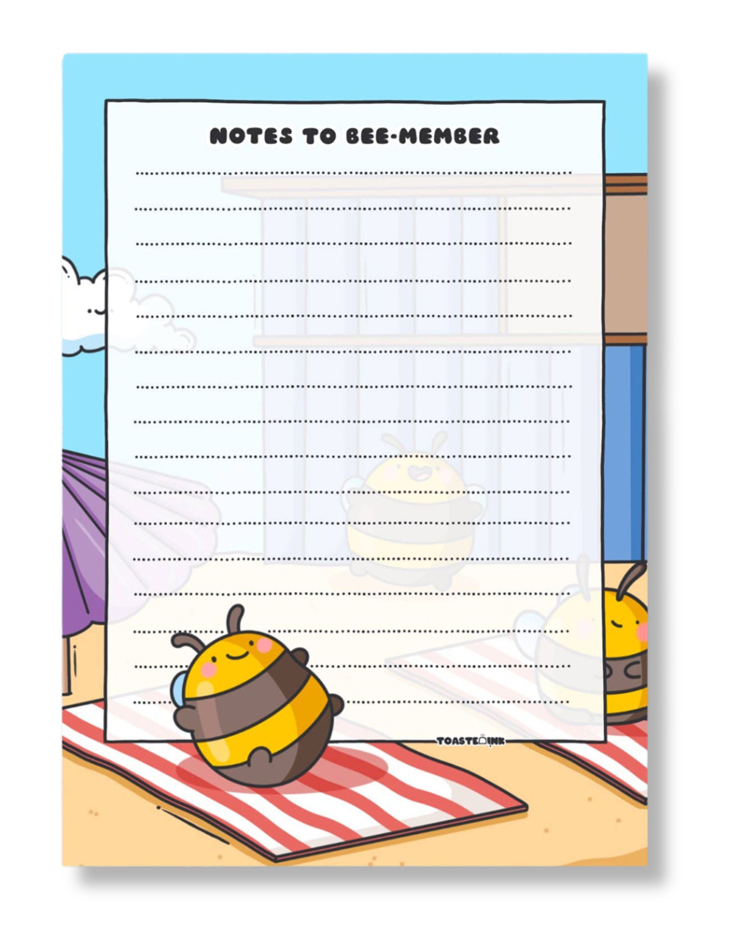 Notepad with cartoon bee design and text on a colorful background
