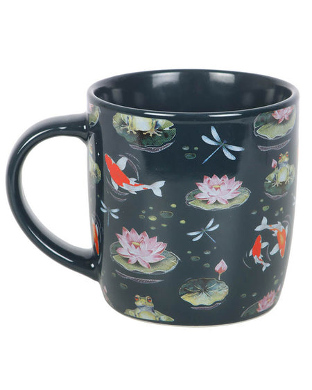 A full side view of the ceramic mug with detailed pond-inspired illustrations, including koi fish and blooming lilies, on a plain white background.