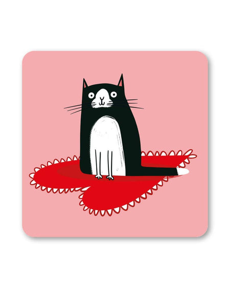 A square Smitten Coaster by Lucy Maggie Designs, featuring a cute black and white cat with wide eyes sitting on a red heart-shaped doily, set against a soft pink background.