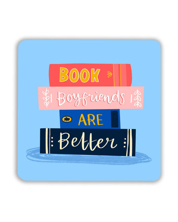Square coaster with a light blue background, featuring a stack of four colourful books. Each book spine spells out the phrase “Book Boyfriends Are Better” in yellow, pink, and navy blue. Perfect for book lovers and romantics.