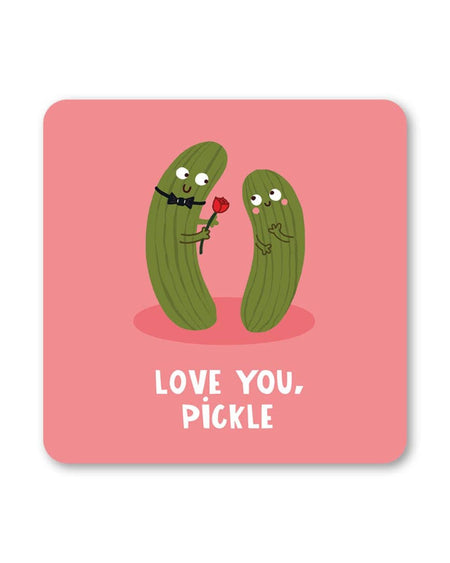 A square pink coaster featuring two illustrated pickles, one wearing a bow tie and offering a red rose to the other, with the phrase “Love You, Pickle” written below in white capital letters.