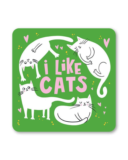 A square green coaster with the words I Like Cats in bold pink letters. Surrounding the text are four white cartoon-style cats in playful poses, with scattered pink hearts and yellow dots.
