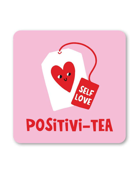 A square pink coaster featuring a smiling tea bag with a red heart and a tag that says Self Love. Below, the words Positivi-Tea are written in bold red letters.