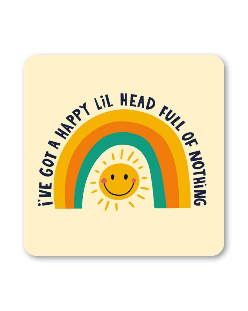Square cream coaster with a retro rainbow arch and a yellow smiley sun in the middle. Black text reads “I’ve got a happy lil head full of nothing” around the design.